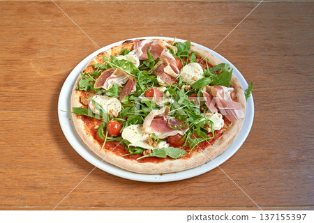 Pizza bufala on white plate on wooden table 137155397