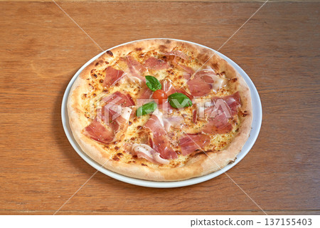 Pizza italian ham on white plat on wooden table Pizza italian ham on white plat on wooden table 137155403