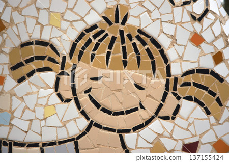 drawings of children's faces made up of small pieces of tile 137155424