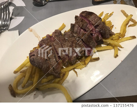 beef chop with sauce and chips 137155476