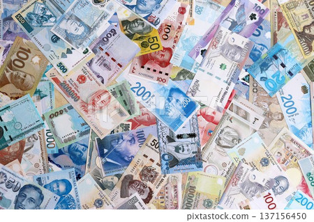 Different banknotes from many currencies of the whole world. Big pile of money bills close up 137156450