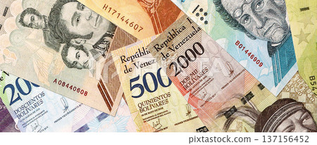 Venezuelan Bolivar currency money bills in big amount. Bunch of VED currency banknotes with different denomination close up Venezuelan Bolivar currency money bills in big amount. Bunch of VED currency banknotes with different denomination close up 137156452