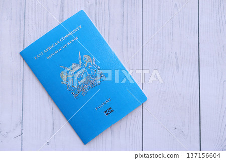 Kenyan passport on table close up. Official identification document book for citizens of Kenya. Concept of travel and tourism Kenyan passport on table close up. Official identification document book for citizens of Kenya. Concept of travel and tourism 137156604