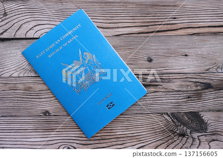 Kenyan passport on table close up. Official identification document book for citizens of Kenya. Concept of travel and tourism Kenyan passport on table close up. Official identification document book for citizens of Kenya. Concept of travel and tourism 137156605