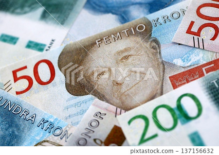 Swedish krona paper banknotes pile on table. Sweden SEK currency money bills in big amount. Concept of economics, taxation and banking in Sweden 137156632