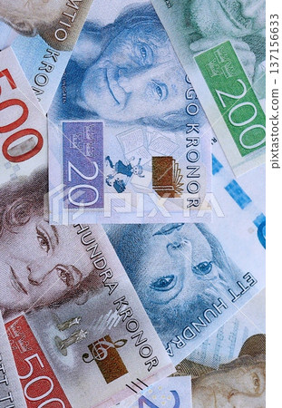 Swedish krona paper banknotes pile on table. Sweden SEK currency money bills in big amount. Concept of economics, taxation and banking in Sweden 137156633