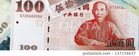 Taiwanese dollar paper banknotes pile on table. Taiwan TWD currency money bills in big amount. Concept of economics, taxation and banking in Taiwan Taiwanese dollar paper banknotes pile on table. Taiwan TWD currency money bills in big amount. Concept of economics, taxation and banking in Taiwan 137156637
