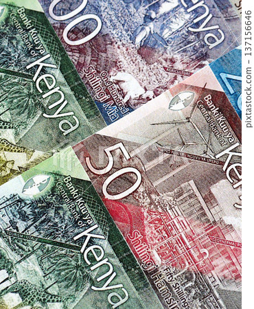 Kenyan shilling paper banknotes pile on table. Kenya KES currency money bills in big amount. Concept of economics, taxation and banking in Kenya Kenyan shilling paper banknotes pile on table. Kenya KES currency money bills in big amount. Concept of economics, taxation and banking in Kenya 137156646
