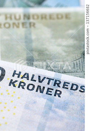 Danish krone paper banknotes pile on table. Denmark DKK currency money bills in big amount. Concept of economics, taxation and banking in Denmark Danish krone paper banknotes pile on table. Denmark DKK currency money bills in big amount. Concept of economics, taxation and banking in Denmark 137156682