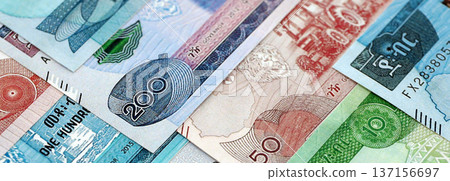 Ethiopian birr paper banknotes pile on table. Ethiopia ETB currency money bills in big amount. Concept of economics, taxation and banking in Ethiopia 137156697