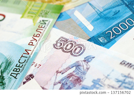 Russian ruble paper banknotes pile on table. Russia RUB currency money bills in big amount. Concept of economics, taxation and banking in Russia 137156702