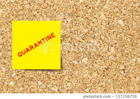 Yellow note paper with word quarantine on cork board background with copy space Yellow note paper with word quarantine on cork board background with copy space 137156739