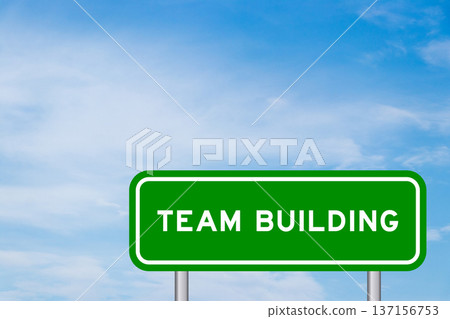 Green color transportation sign with word team building on blue sky with white cloud background 137156753