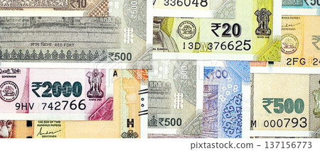 Big pile of Indian Rupees money bills banknotes close up. Lots of money of Indian INR currency cash in big bunch. Economics and business in India 137156773