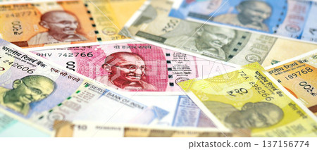 Big pile of Indian Rupees money bills banknotes close up. Lots of money of Indian INR currency cash in big bunch. Economics and business in India Big pile of Indian Rupees money bills banknotes close up. Lots of money of Indian INR currency cash in big bunch. Economics and business in India 137156774