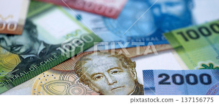 Big amount of chilean pesos money bills banknotes. Huge quantity of paper money from Chile country close up. Concept of business and economy in Chile Big amount of chilean pesos money bills banknotes. Huge quantity of paper money from Chile country close up. Concept of business and economy in Chile 137156775
