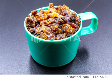 beautiful texture ripe of natural raisins on background beautiful texture ripe of natural raisins on background 137156900