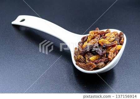 beautiful texture ripe of natural raisins on background beautiful texture ripe of natural raisins on background 137156914
