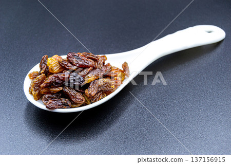 beautiful texture ripe of natural raisins on background beautiful texture ripe of natural raisins on background 137156915