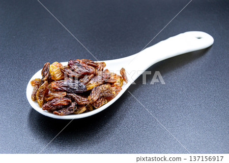 beautiful texture ripe of natural raisins on background beautiful texture ripe of natural raisins on background 137156917