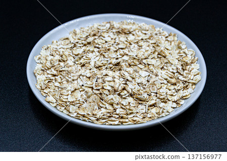 beautiful texture ripe of natural flakes oat on background beautiful texture ripe of natural flakes oat on background 137156977