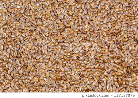 beautiful texture ripe of natural flax seeds on background beautiful texture ripe of natural flax seeds on background 137157079