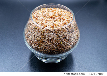 beautiful texture ripe of natural flax seeds on background beautiful texture ripe of natural flax seeds on background 137157083