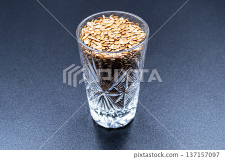 beautiful texture ripe of natural flax seeds on background beautiful texture ripe of natural flax seeds on background 137157097