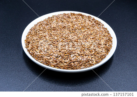 beautiful texture ripe of natural flax seeds on background beautiful texture ripe of natural flax seeds on background 137157101