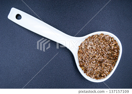 beautiful texture ripe of natural flax seeds on background beautiful texture ripe of natural flax seeds on background 137157109