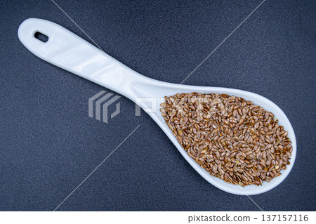 beautiful texture ripe of natural flax seeds on background beautiful texture ripe of natural flax seeds on background 137157116