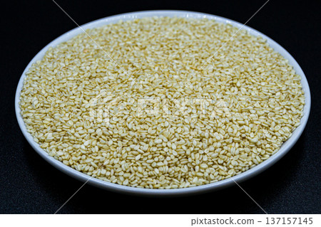 beautiful texture ripe of natural sesame seeds on background 137157145