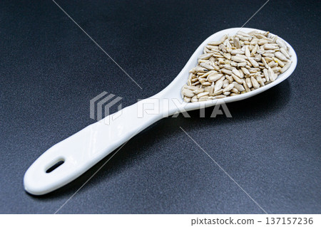 beautiful texture ripe of natural sunflower seeds on background beautiful texture ripe of natural sunflower seeds on background 137157236
