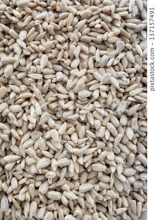 Close up of peeled sunflower seeds. Close up of peeled sunflower seeds. 137157491