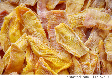 Close up of dried slices of sweet mango. 137157494