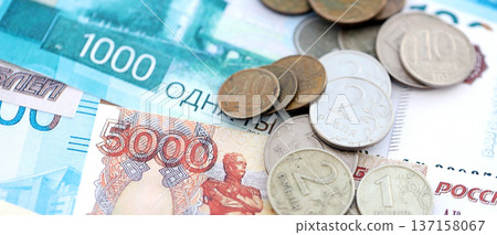 Coins and banknotes of Russian Federation ruble currency. Russia RUB money close up. Business, economy and finance concept Coins and banknotes of Russian Federation ruble currency. Russia RUB money close up. Business, economy and finance concept 137158067