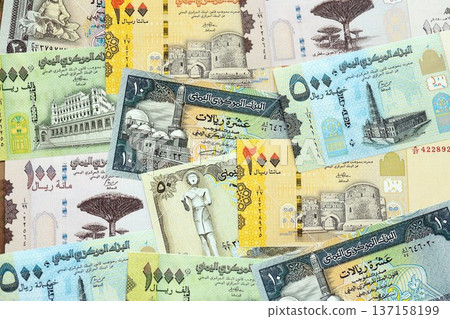 Yemeni rial paper banknotes pile on table. Yemen YER currency money bills in big amount. Concept of economics, taxation and banking in Yemen 137158199