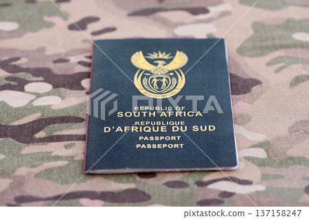South African passport on table close up. Official identification document book for citizens of South Africa. Concept of travel and tourism 137158247