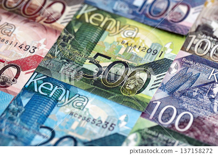 Kenyan shilling paper banknotes pile on table. Kenya KES currency money bills in big amount. Concept of economics, taxation and banking in Kenya 137158272