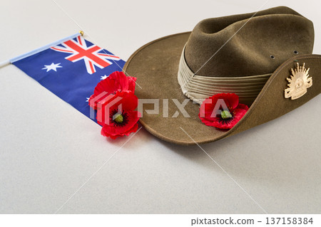 Australian flag, slouch hat, and red poppies honoring anzac day Australian flag, slouch hat, and red poppies honoring anzac day 137158384