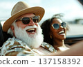 Cinematic photo of happy senior man with white beard and afro woman in cabriolet car. Happy moment concept 137158392