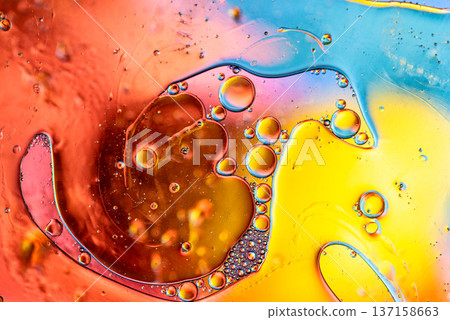 Bright Yellow and Purple Oil Drops Reflection Macro Bright Yellow and Purple Oil Drops Reflection Macro 137158663