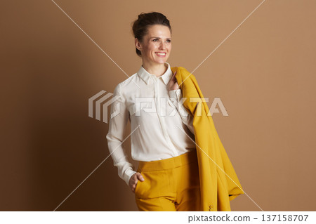Confident Businesswoman with Yellow Blazer Confident Businesswoman with Yellow Blazer 137158707