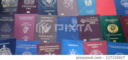 Big amount of passports of various different countries. Covers of expired passports close up. Travel documents for tourism 137158927