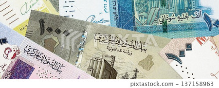 Sudanese pound paper banknotes pile on table. Sudan SDG currency money bills in big amount. Concept of economics, taxation and banking in Sudan Sudanese pound paper banknotes pile on table. Sudan SDG currency money bills in big amount. Concept of economics, taxation and banking in Sudan 137158963