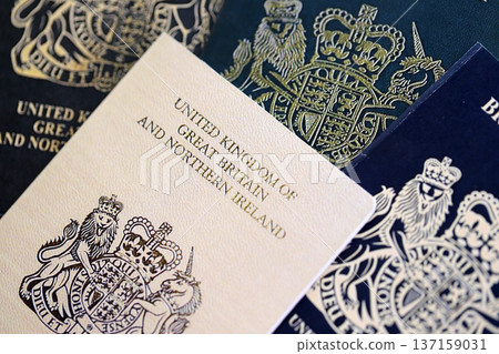 British and Gibraltar passports on table close up. Official identification document books for citizens of United Kingdom. Concept of travel and tourism 137159031