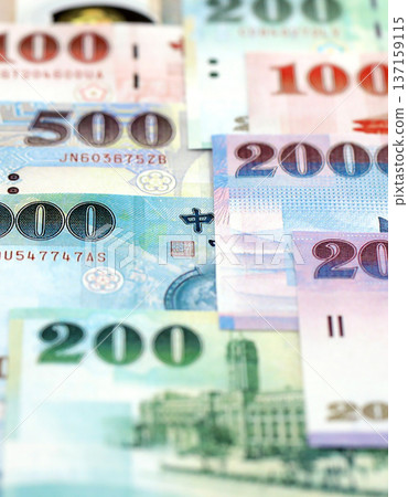 Taiwanese dollar paper banknotes pile on table. Taiwan TWD currency money bills in big amount. Concept of economics, taxation and banking in Taiwan 137159115