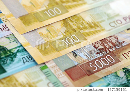 Russian ruble paper banknotes pile on table. Russia RUB currency money bills in big amount. Concept of economics, taxation and banking in Russia 137159161