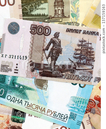 Russian ruble paper banknotes pile on table. Russia RUB currency money bills in big amount. Concept of economics, taxation and banking in Russia 137159163