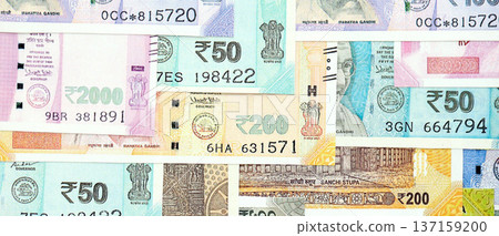 Big pile of Indian Rupees money bills banknotes close up. Lots of money of Indian INR currency cash in big bunch. Economics and business in India Big pile of Indian Rupees money bills banknotes close up. Lots of money of Indian INR currency cash in big bunch. Economics and business in India 137159200
